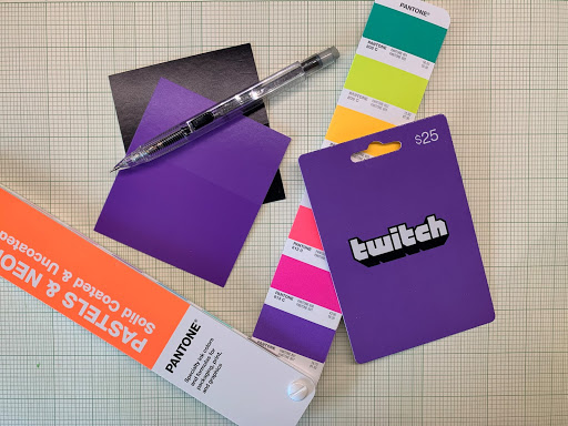 A pantone color strip and a printed gift card (Twitch).